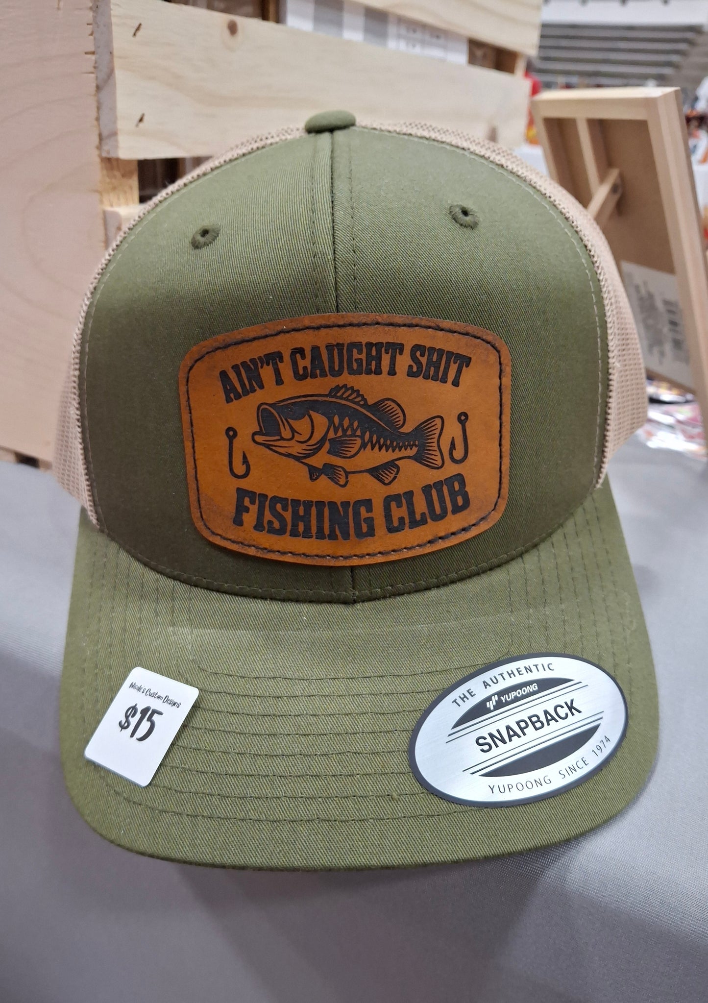 Ain't Caught Shit Fishing Club Trucker Hat